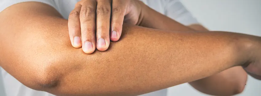 Physiotherapist treating tennis elbow patient at Curis 360 Bangalore clinic